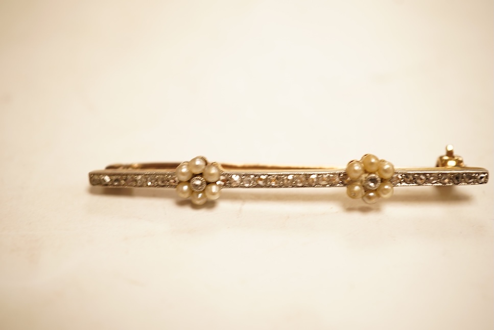 An Edwardian yellow metal, seed pearl and millegrain set diamond bar brooch, 51mm, gross weight 2.9 grams.